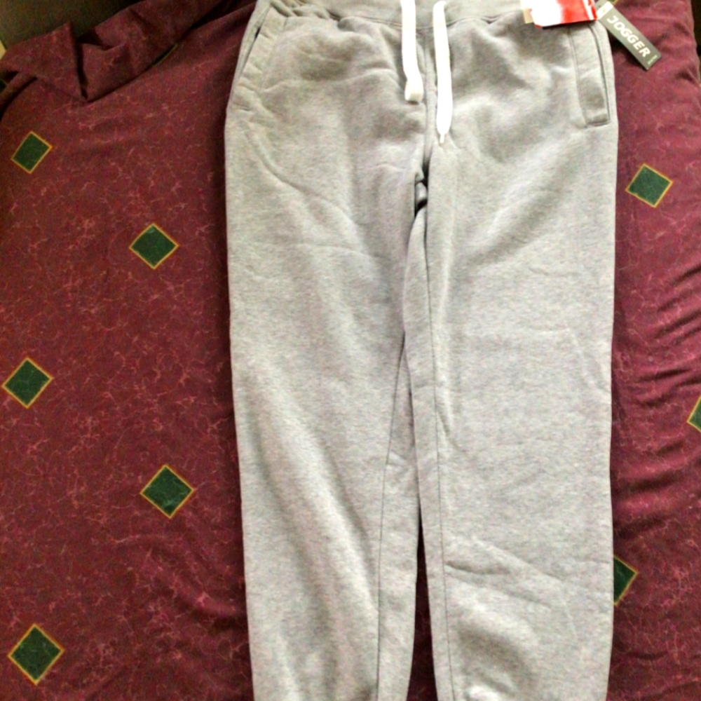 A pair of grey joggers, size: LARGE